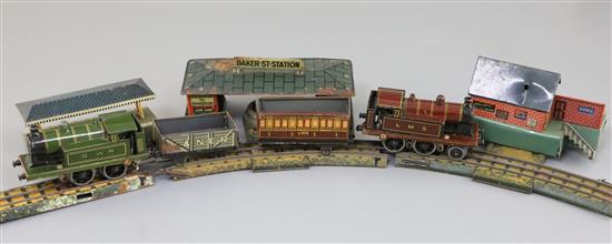 A Bing 00 gauge tinplate electric train set, with track, two tank engines, Baker Street Station building, two other